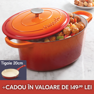 vas de fonta portocaliu oval pe masa